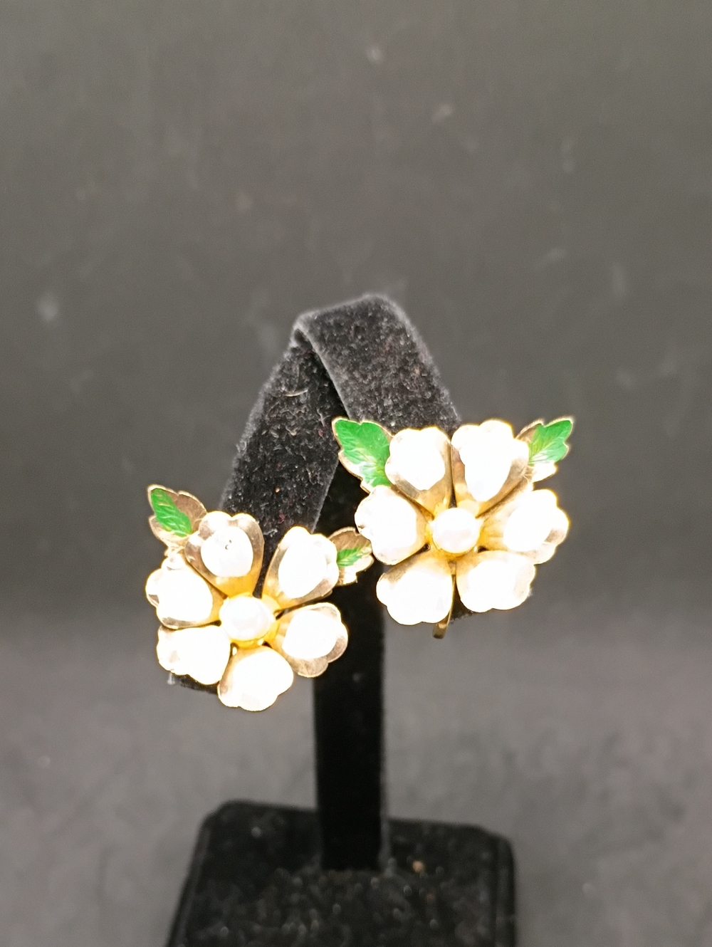 White Enamel Flower Clip-On Earrings with Green Leaves